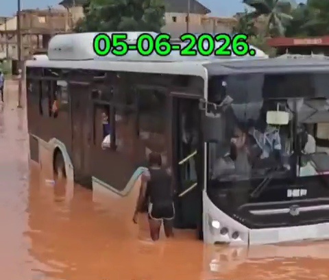 Commuters stuck inside bus as flood  grounds cars along Enugu road